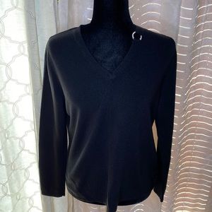 Black sweater with diamond ring